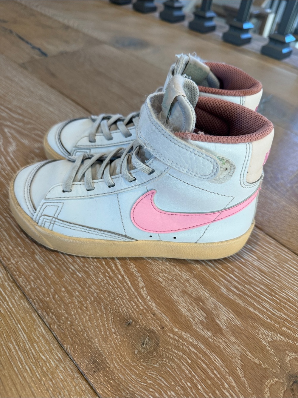 Nike Kids High-Top Sneakers in White with Pink Swoosh